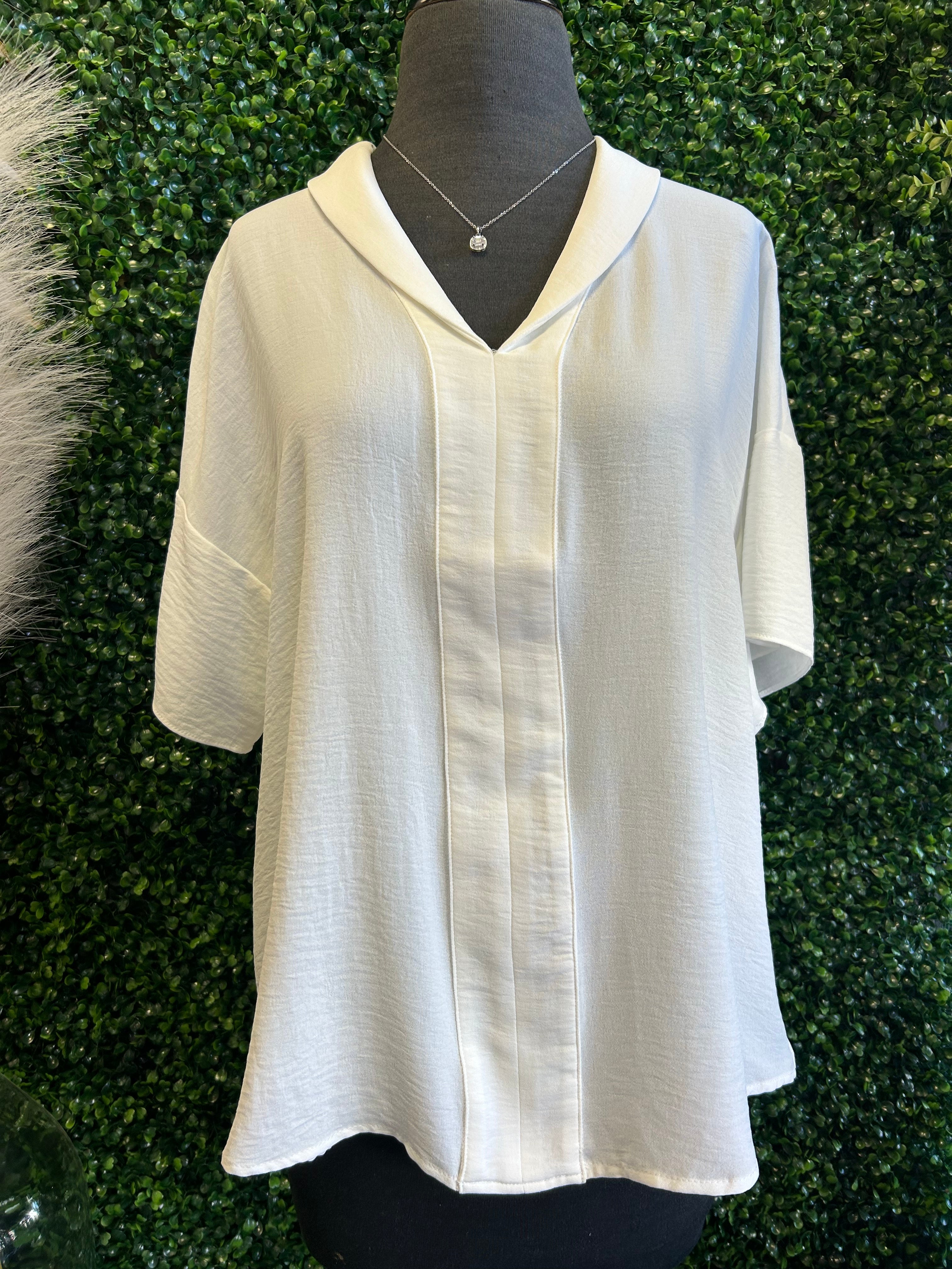 Top with Lapel Collar and Three Quarter Wide Sleeves.