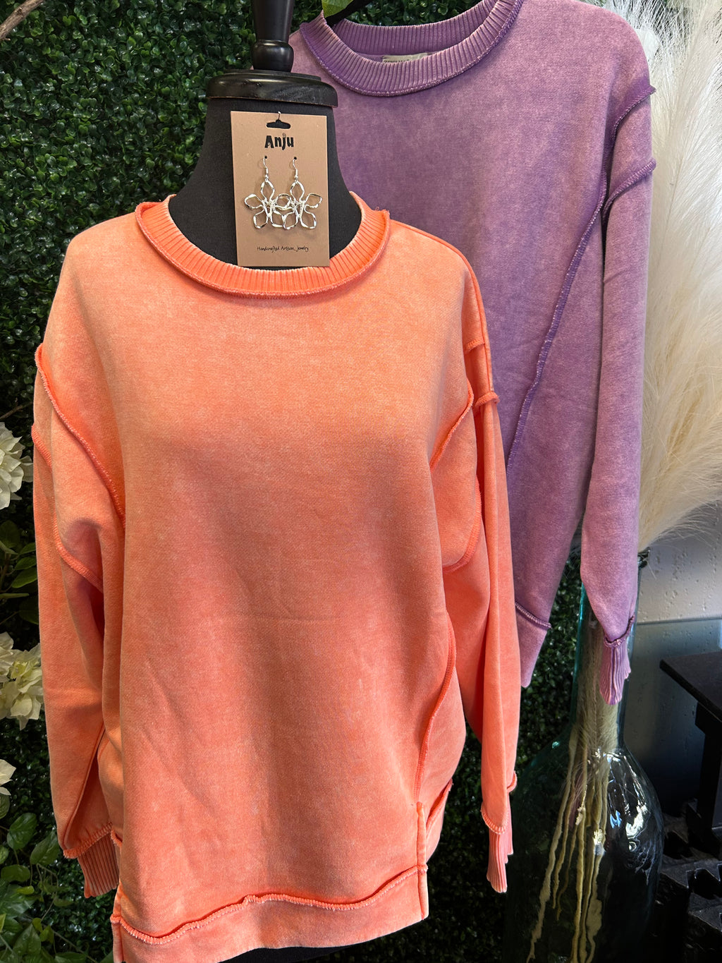 Acid wash exposed-seam fleece sweatshirt