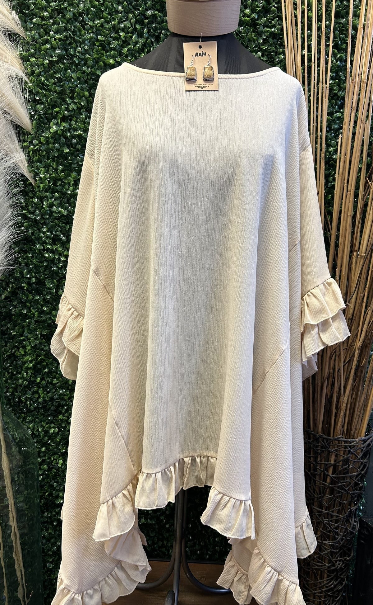 Chic women’s boutique top with ruffles.