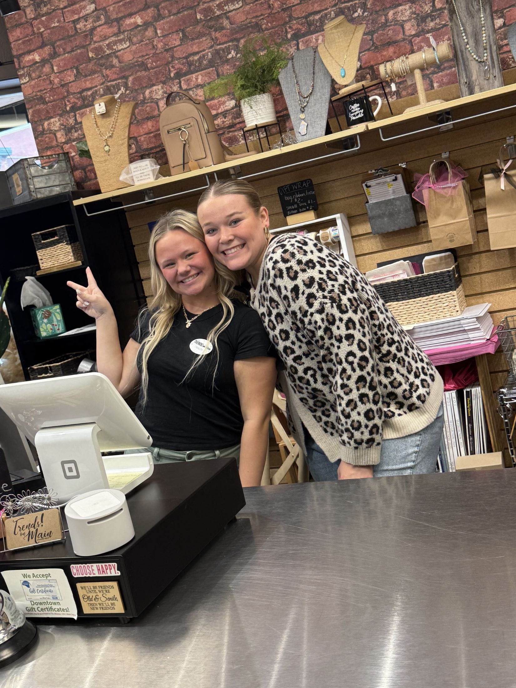 Friendly staff at a local women’s boutique, showcasing trendy women’s clothing and stylish accessories online.