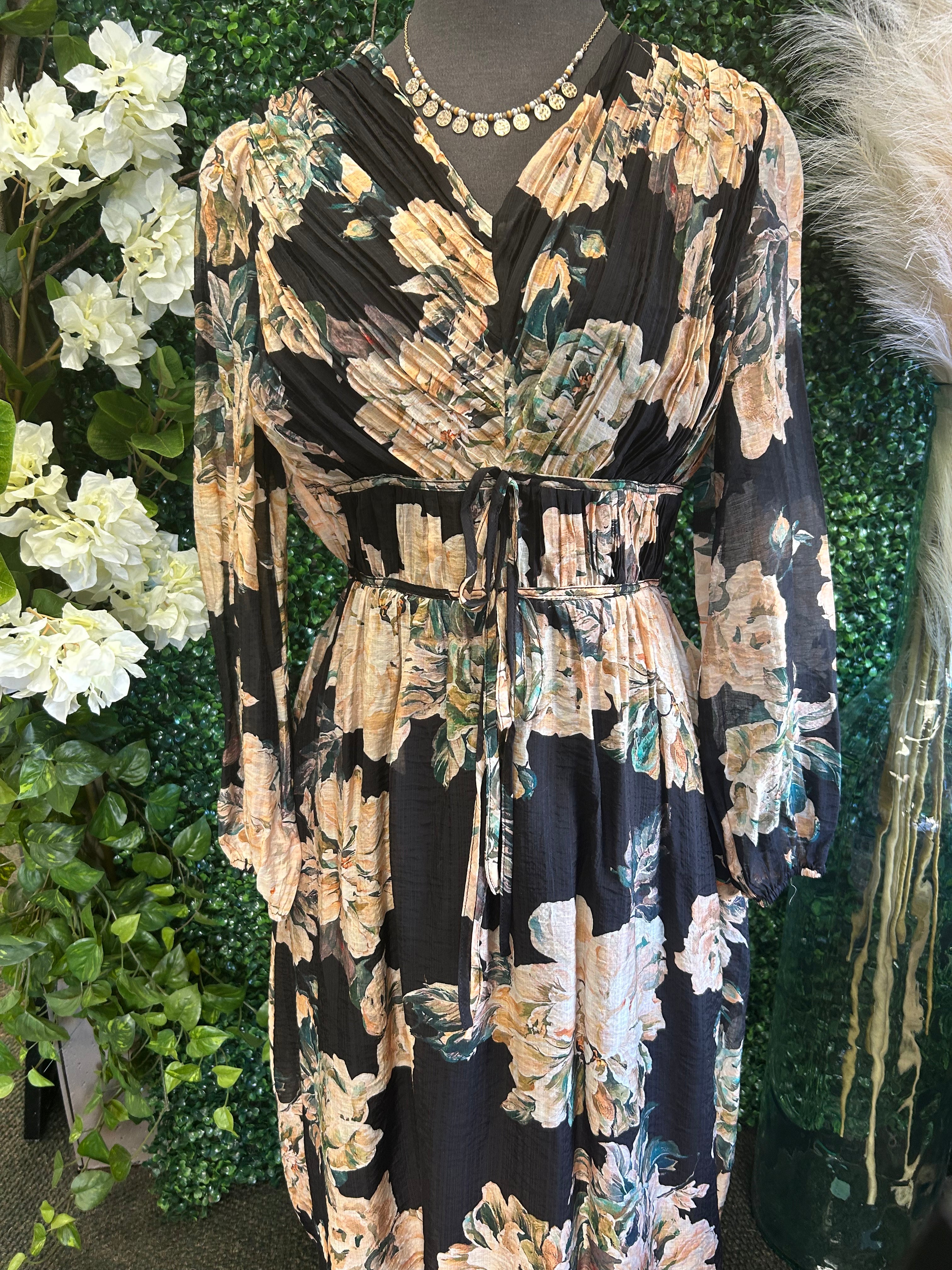 Stylish floral dress from a women’s boutique, perfect for special occasions and everyday fashion.
