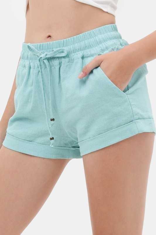 white elastic shorts with pockets